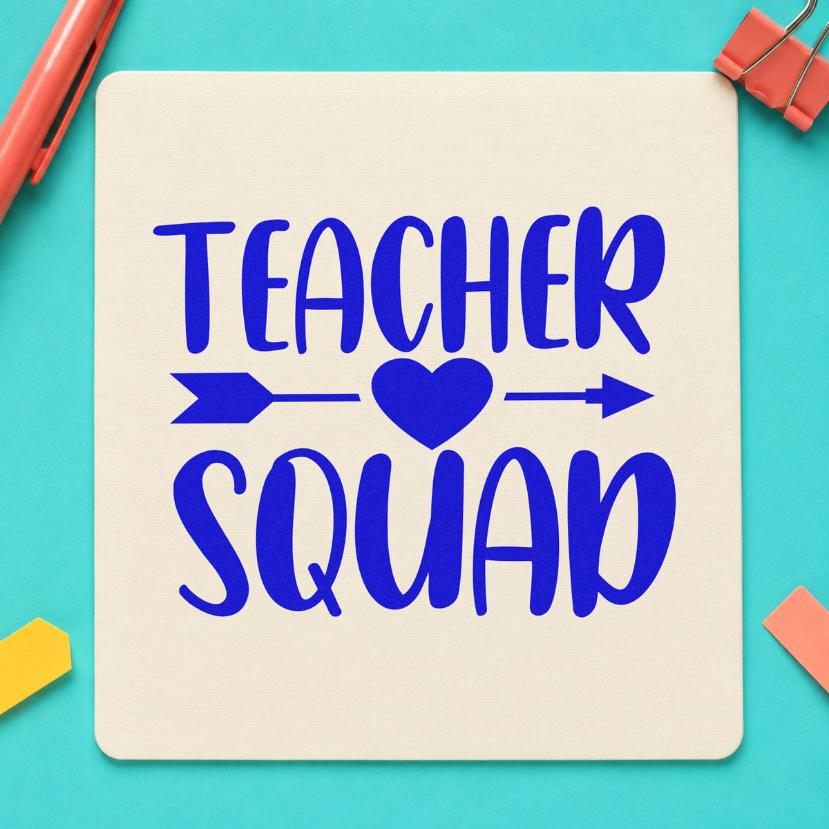 Teacher Squad Heart Arrow craft stamp imprinted in blue ink on paper, a design suited to transfer pack seals.