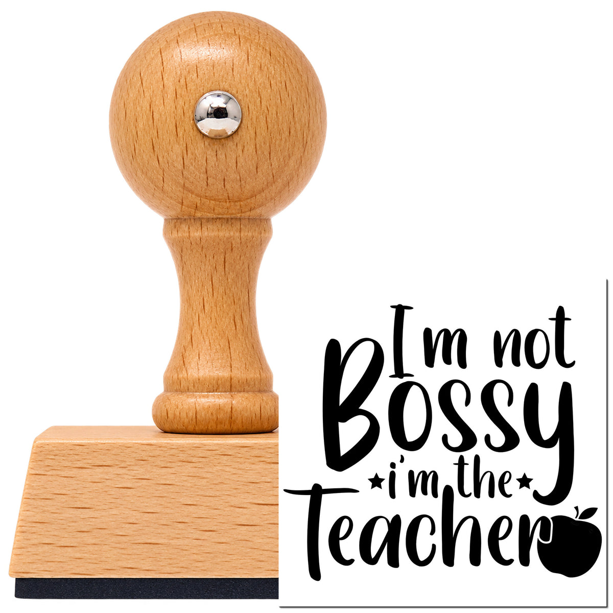 Not Bossy I'm The Teacher Vintage Pro rubber stamp in European beech wood with a round knob handle, shown beside its black imprint.