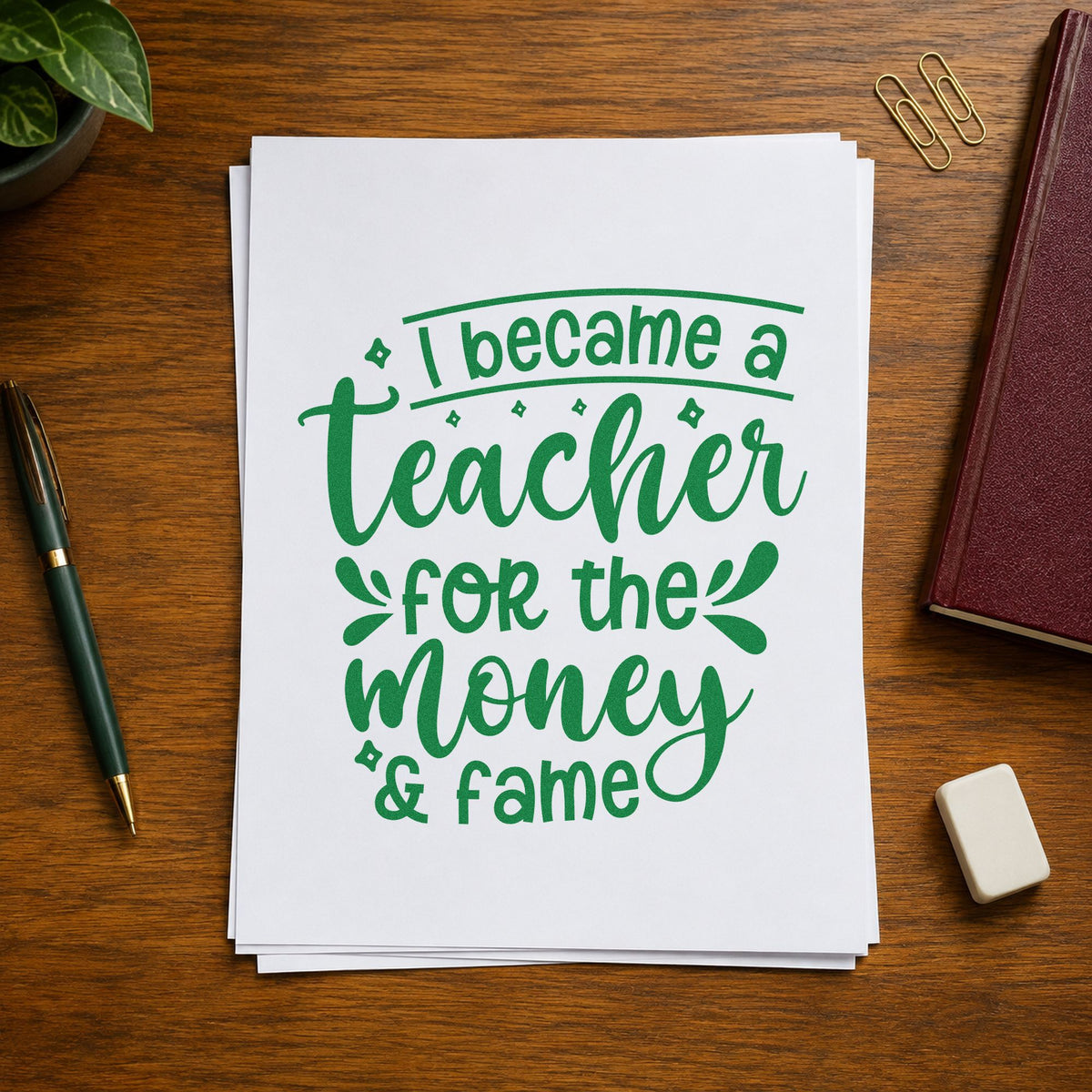 Teacher Money And Fame craft stamp imprint in green ink on a handmade project, one idea being framed staff notice.