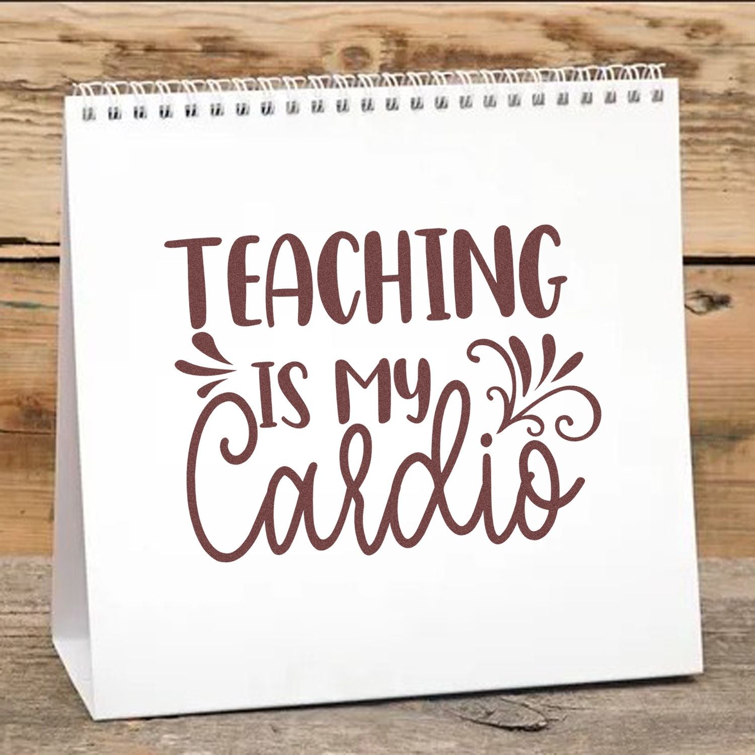 Teacher rubber stamp design with the phrase Teaching is my cardio on a gift bag for classroom gifts and teacher appreciation.