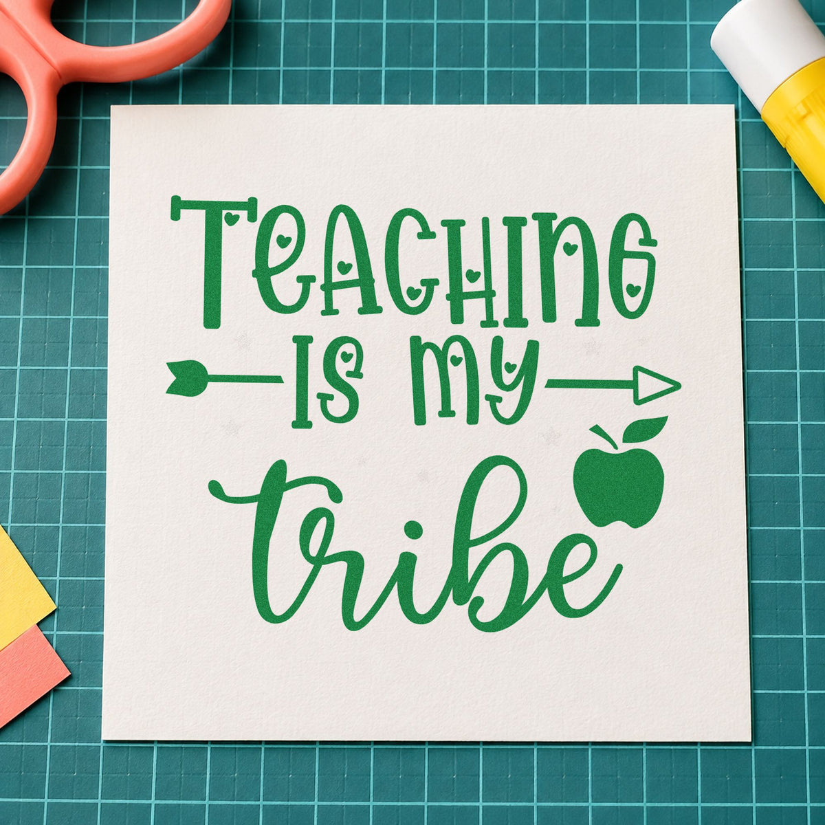 Teaching Is My Tribe craft stamp imprint in green ink on a handmade project, one idea being framed subject room.