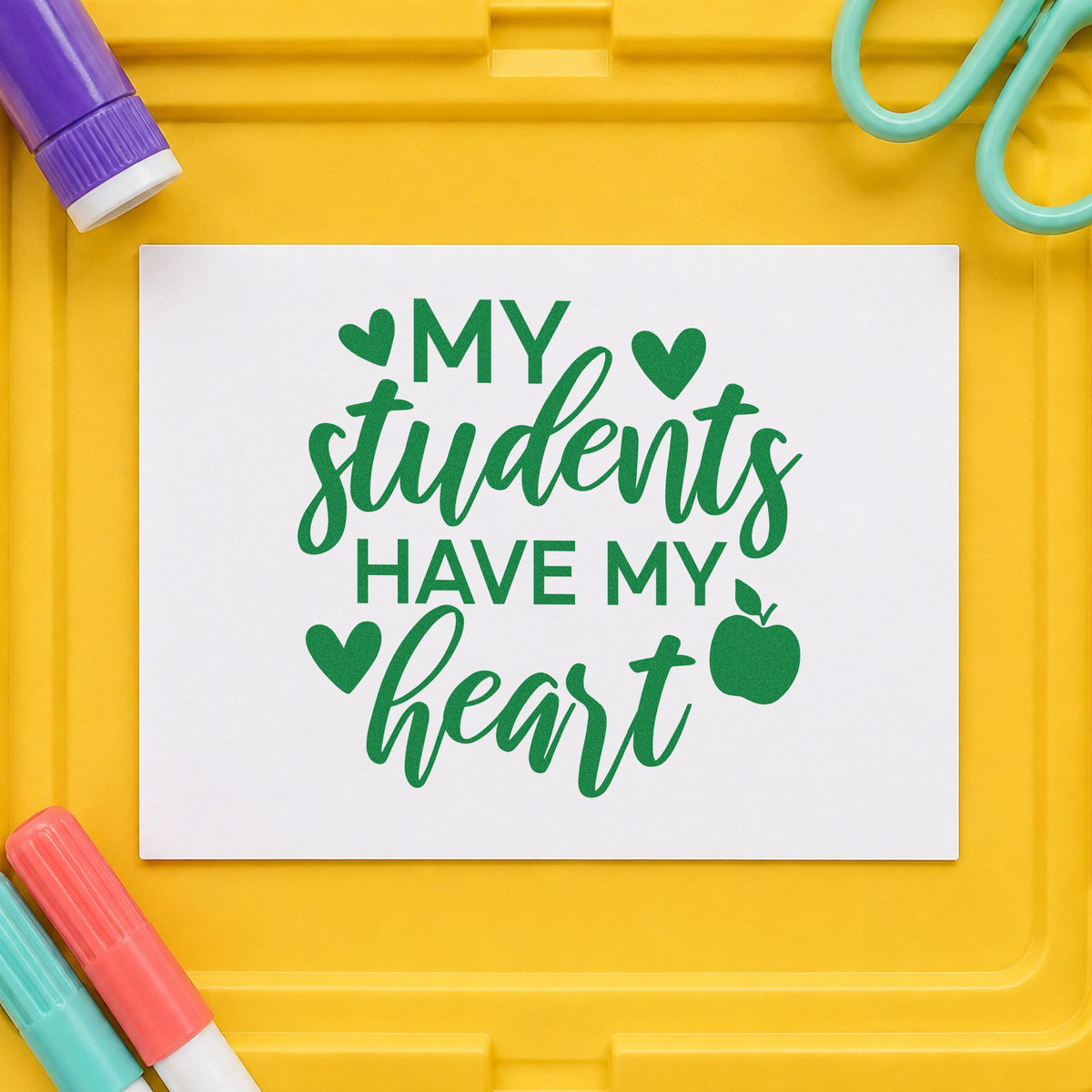 Students Have My Heart Apple craft stamp imprint in green ink on a handmade project, one idea being framed home study.