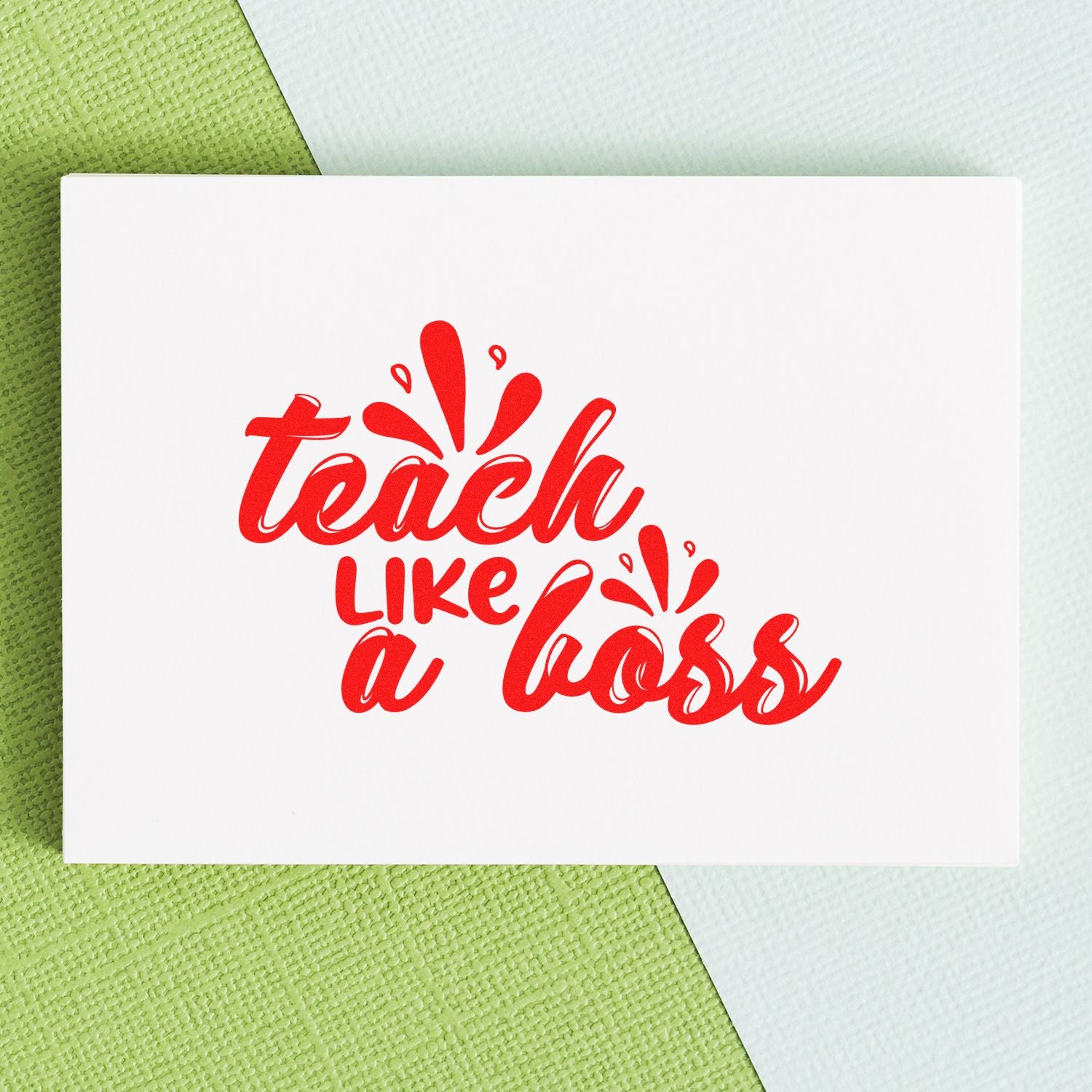 Teacher rubber stamp design reading Teach Like a Boss in red on white card stock.