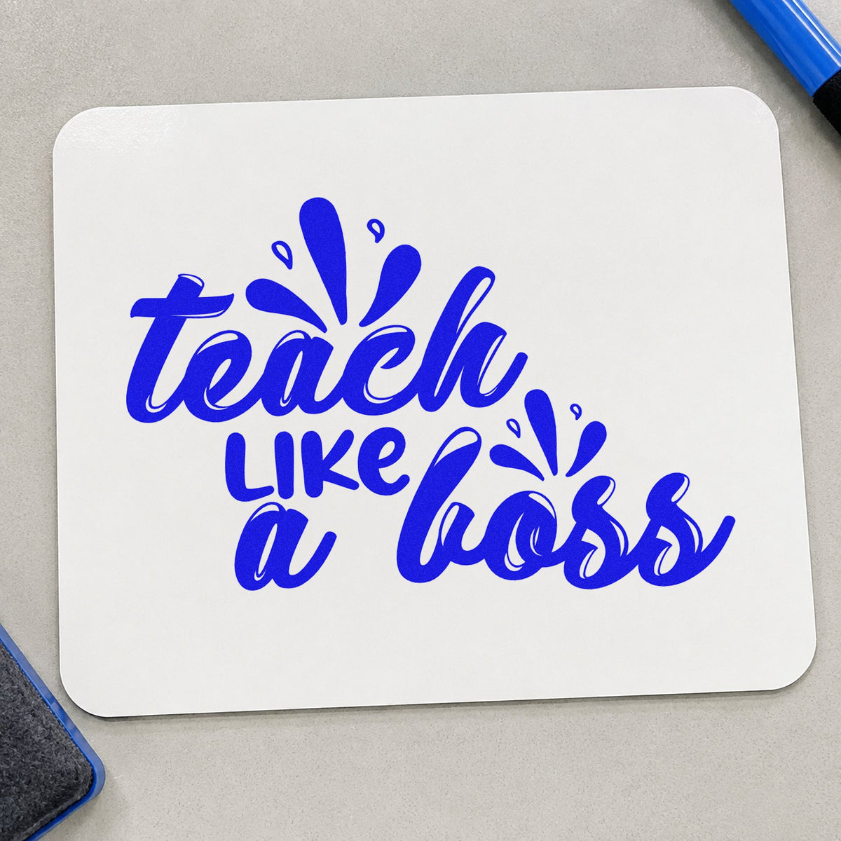 Teach Like A Boss craft stamp imprinted in blue ink on paper, a design suited to portfolio seals.