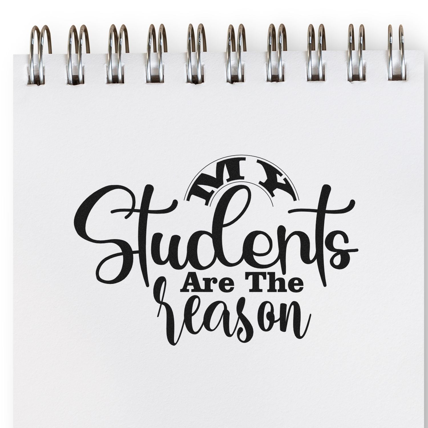 Student-themed rubber stamp design reading Students Are the Reason on a spiral notebook for teacher appreciation.