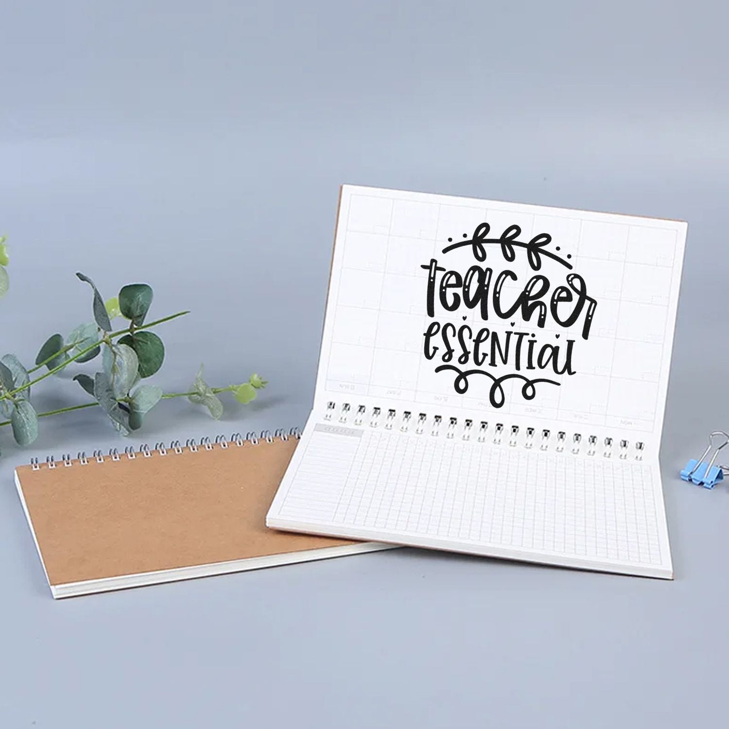 Teacher Essential rubber stamp stamped in an open planner notebook, perfect for classroom organization and teacher crafts.