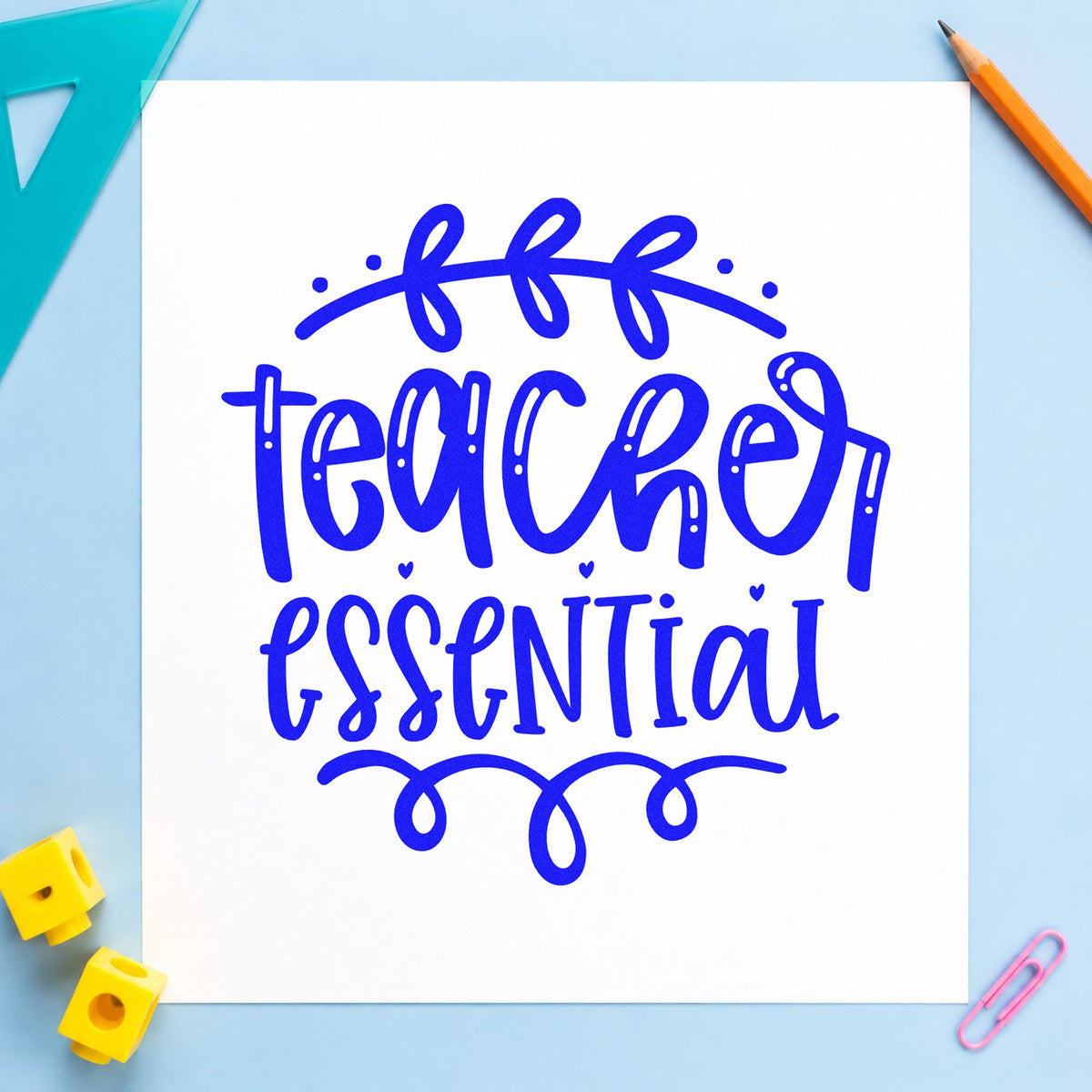 Teacher Essential Leafy Flourish craft stamp imprinted in blue ink on paper, a design suited to bundle wrap seals.
