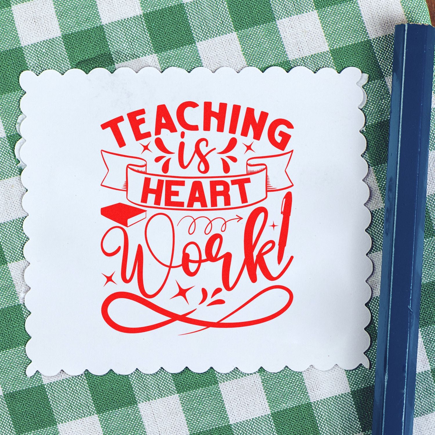 Teaching is Heart Work custom teacher rubber stamp design in red ink on scalloped paper for classroom crafts and gifts.
