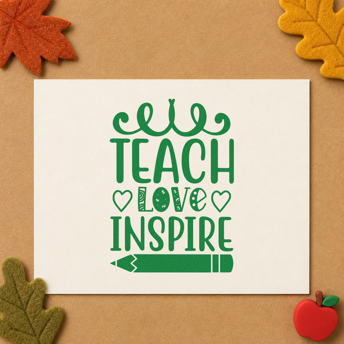 Teach Love Inspire Hearts Pencil craft stamp imprint in green ink on a handmade project, one idea being guest message pages.