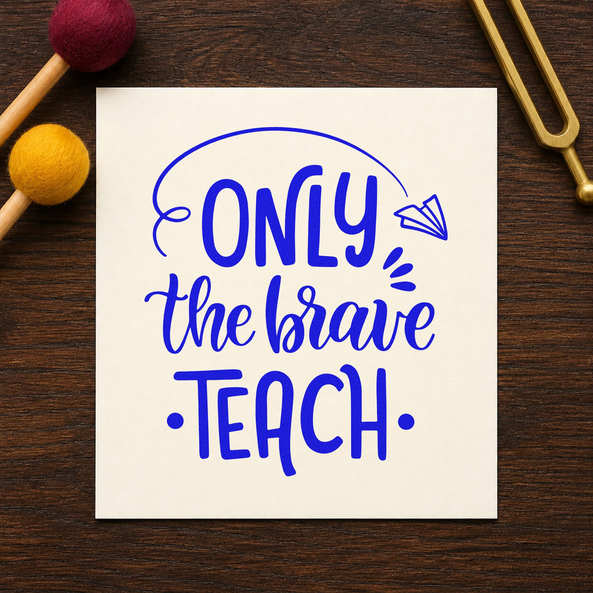 Only Brave Teach Paper Airplane craft stamp imprinted in blue ink on paper, a design suited to launch pack seals.