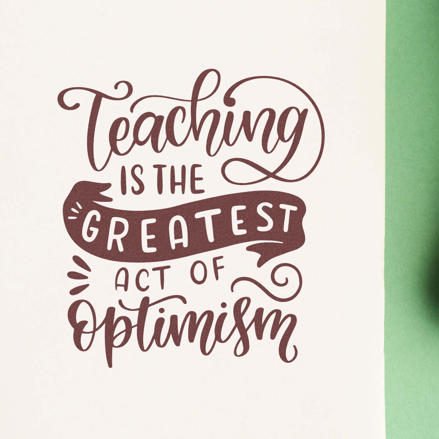 Decorative teacher rubber stamp design with quote Teaching Is the Greatest Act of Optimism for classroom use.