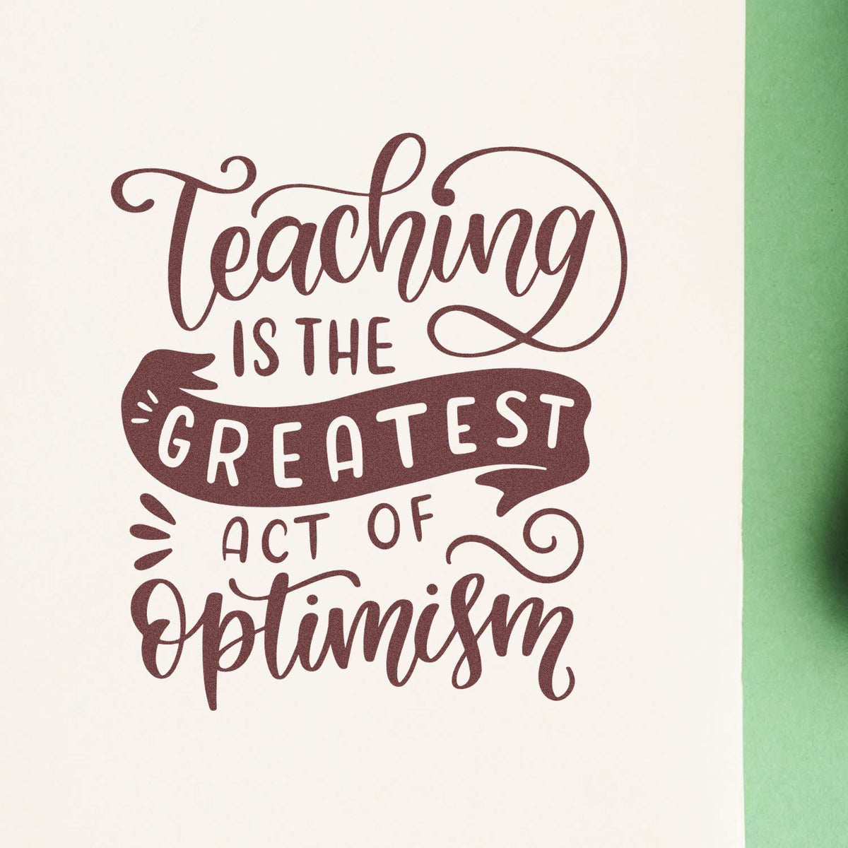 Teaching Greatest Act Of Optimism rubber stamp shown in brown ink, stamped for projects such as new year tags.
