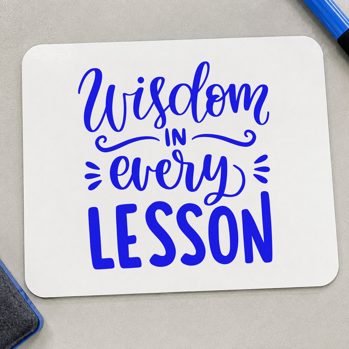 Wisdom In Every Lesson craft stamp in blue ink on cardstock, an easy option for satchel strap panels.
