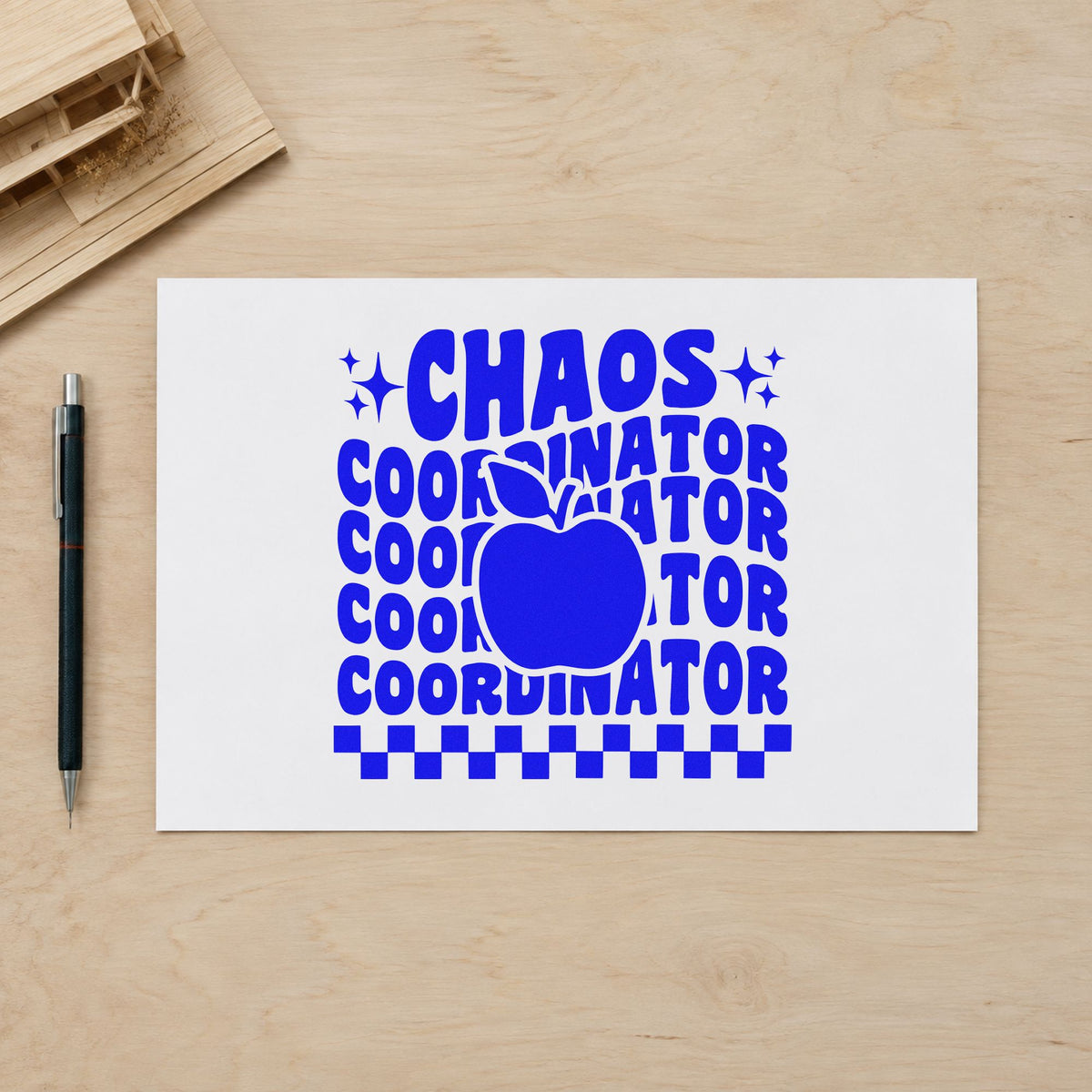 Chaos Coordinator Apple Repeat craft stamp in blue ink on cardstock, an easy option for tabard check panels.