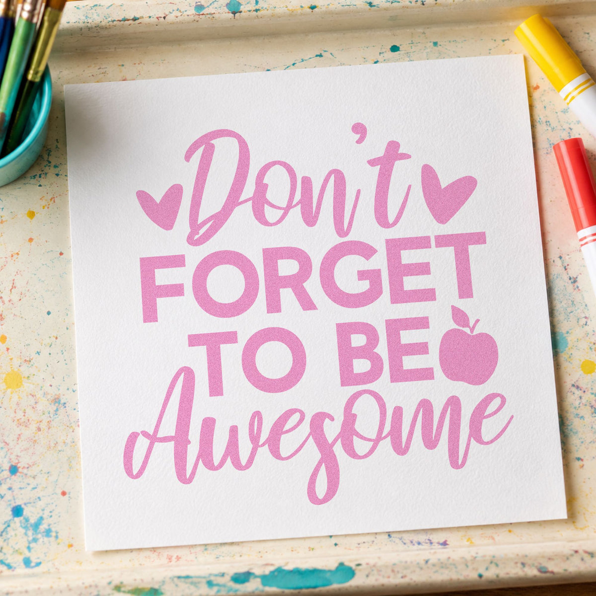 Don't Forget To Be Awesome craft stamp in purple ink on cardstock, an easy option for lunchbox note tags.