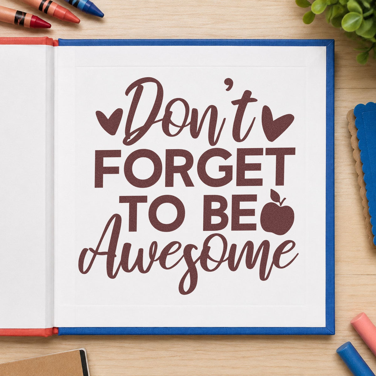 Don't Forget To Be Awesome rubber stamp printed in brown ink, ready for mirror vinyl labels and similar paper crafts.