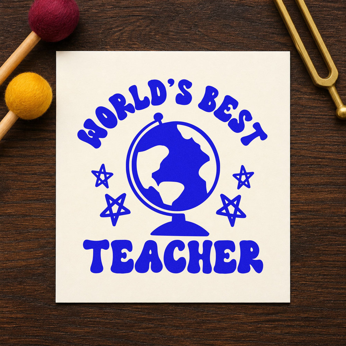 World's Best Teacher Globe craft stamp in blue ink on cardstock, an easy option for night sky panels.