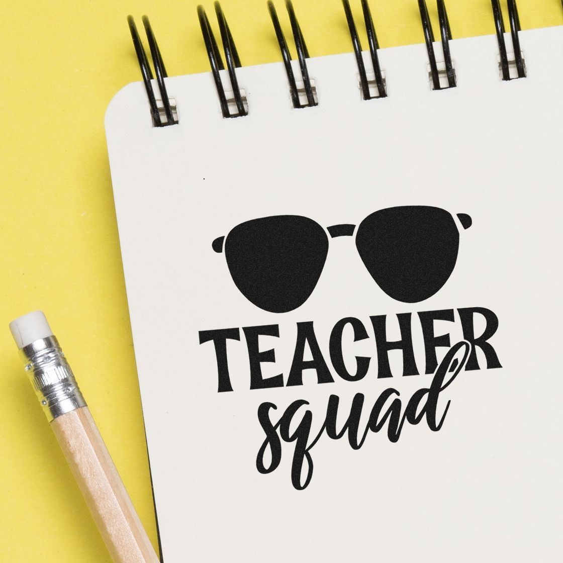Teacher Squad rubber stamp design with sunglasses icon on notebook, perfect for teacher gifts, classroom crafts, and school stationery.