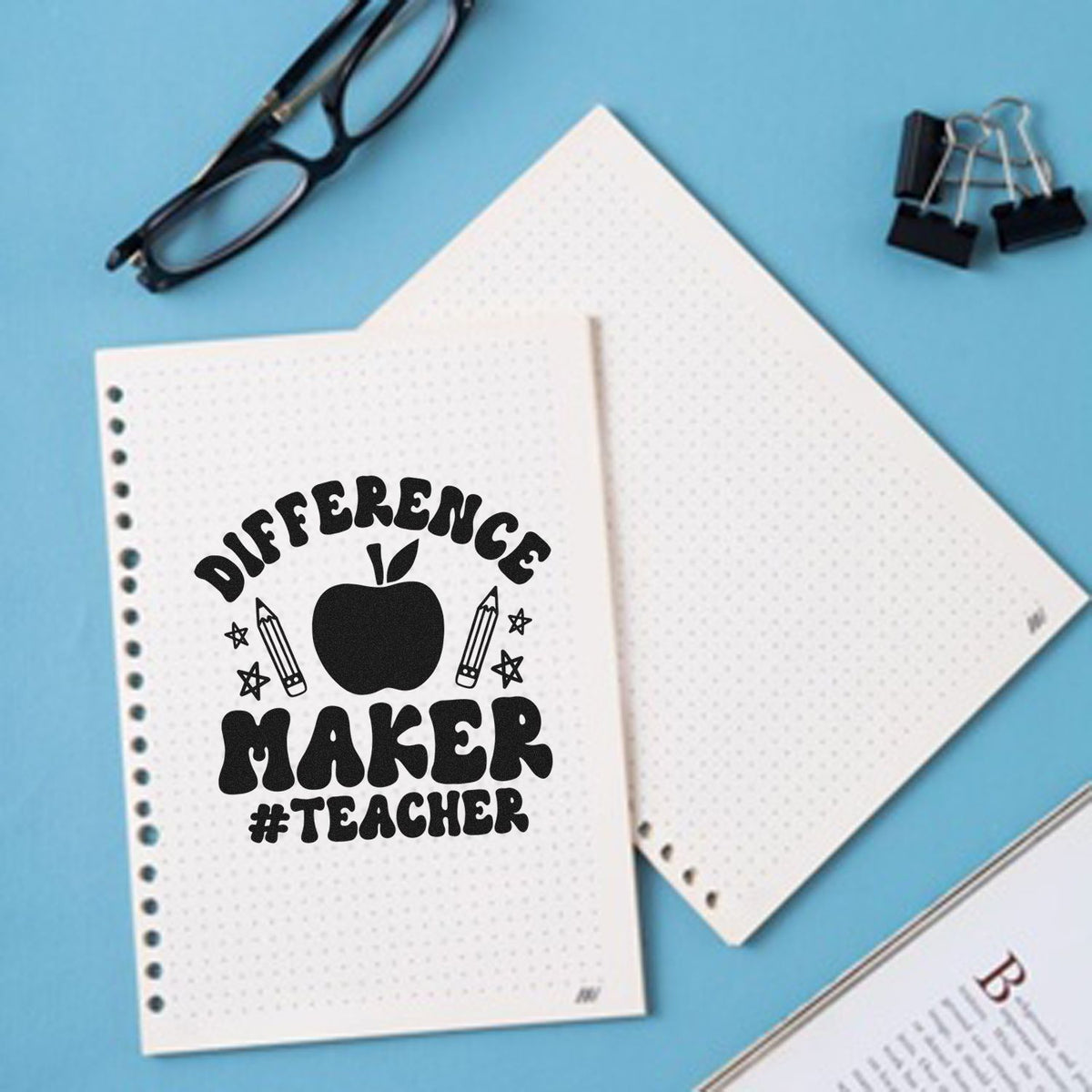 Difference Maker Teacher Apple Stamp - Premium Vintage Pro Wooden imprint stamped in black ink. "Difference Maker #Teacher" surrounds an apple with pencils and stars.