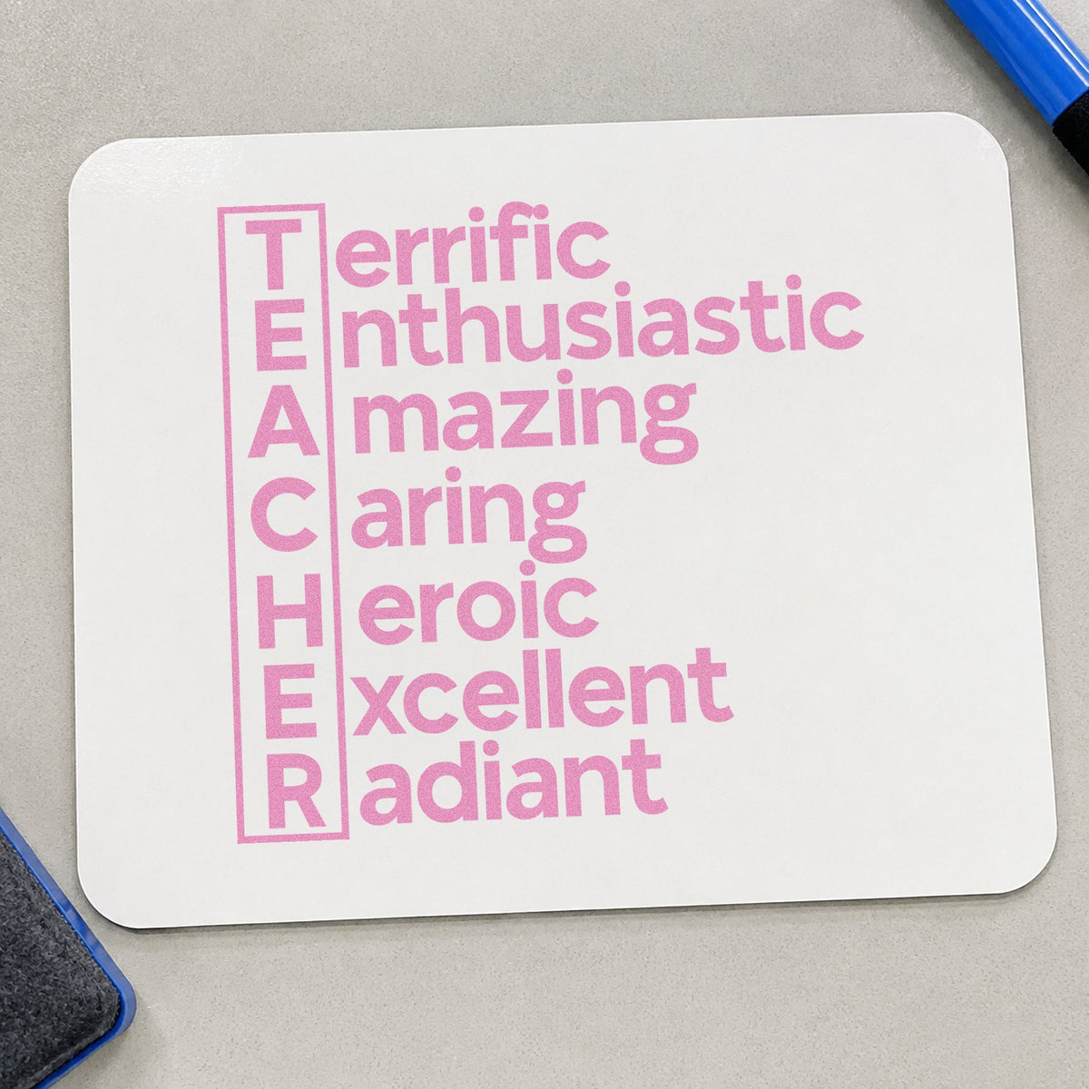 Teacher Traits Acrostic craft stamp in purple ink on cardstock, an easy option for adjective tags.