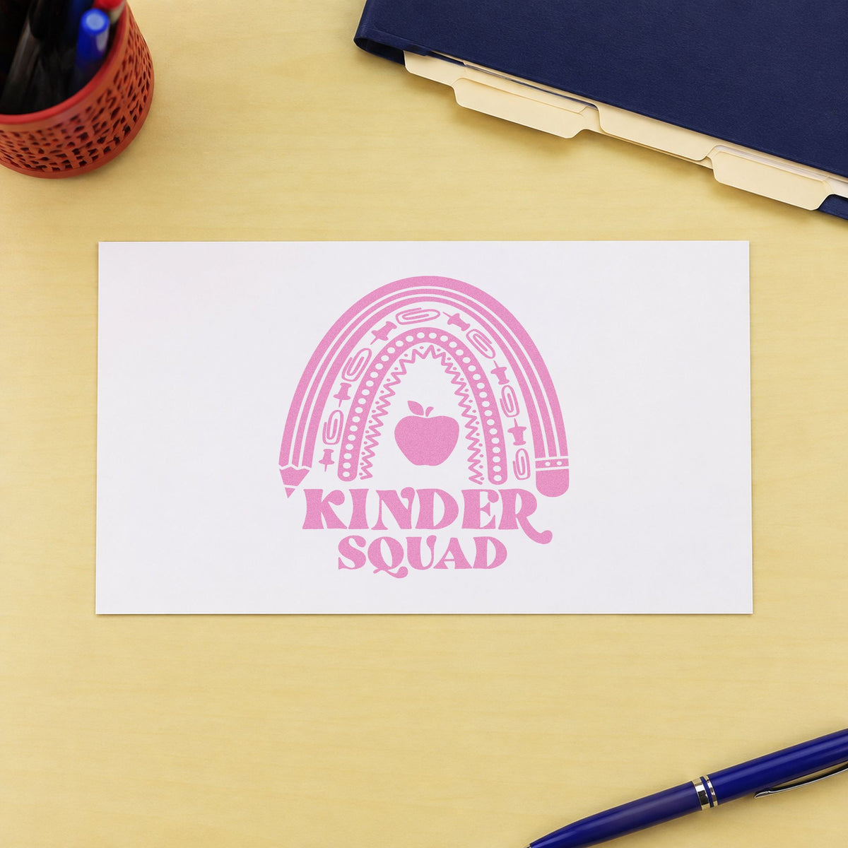 Kinder Squad Rainbow Apple craft stamp in purple ink on cardstock, an easy option for starter pack tags.