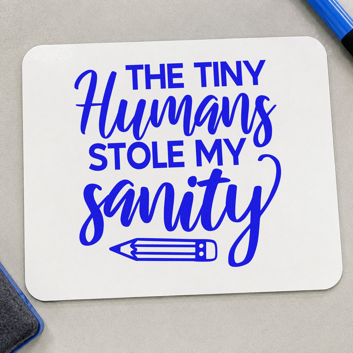 Tiny Humans Stole Sanity craft stamp imprinted in blue ink on paper, a design suited to doubloon bag seals.