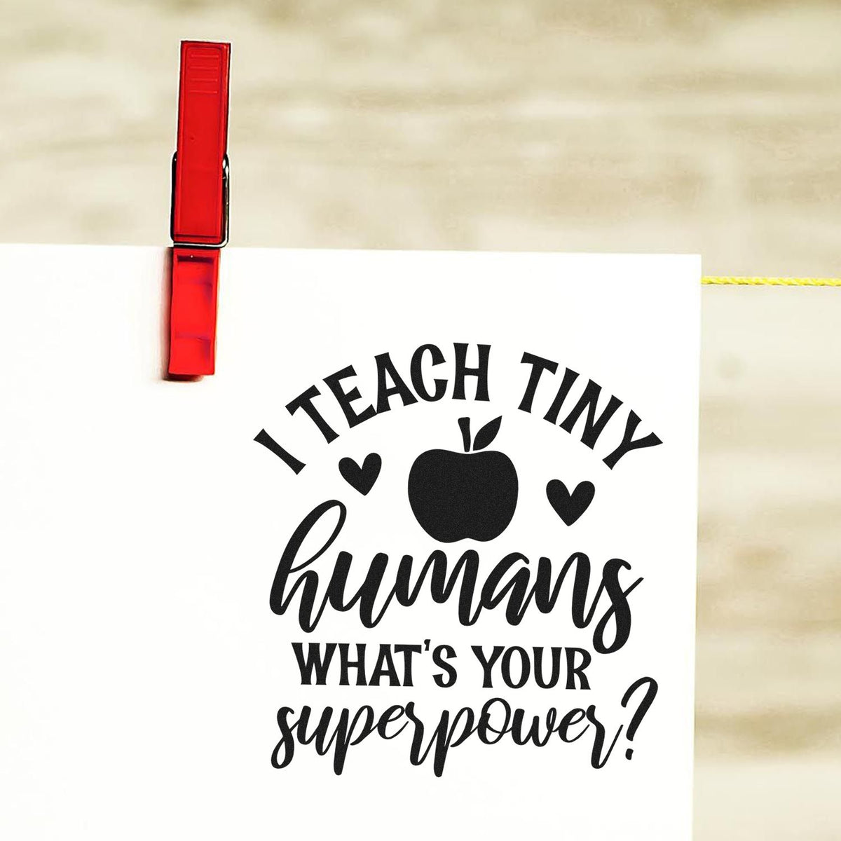 Premium Wooden Teach Tiny Humans Superpower Stamp - Vintage Pro imprint stamped in black ink. "I Teach Tiny Humans What's Your Superpower?" is accented with an apple and hearts.
