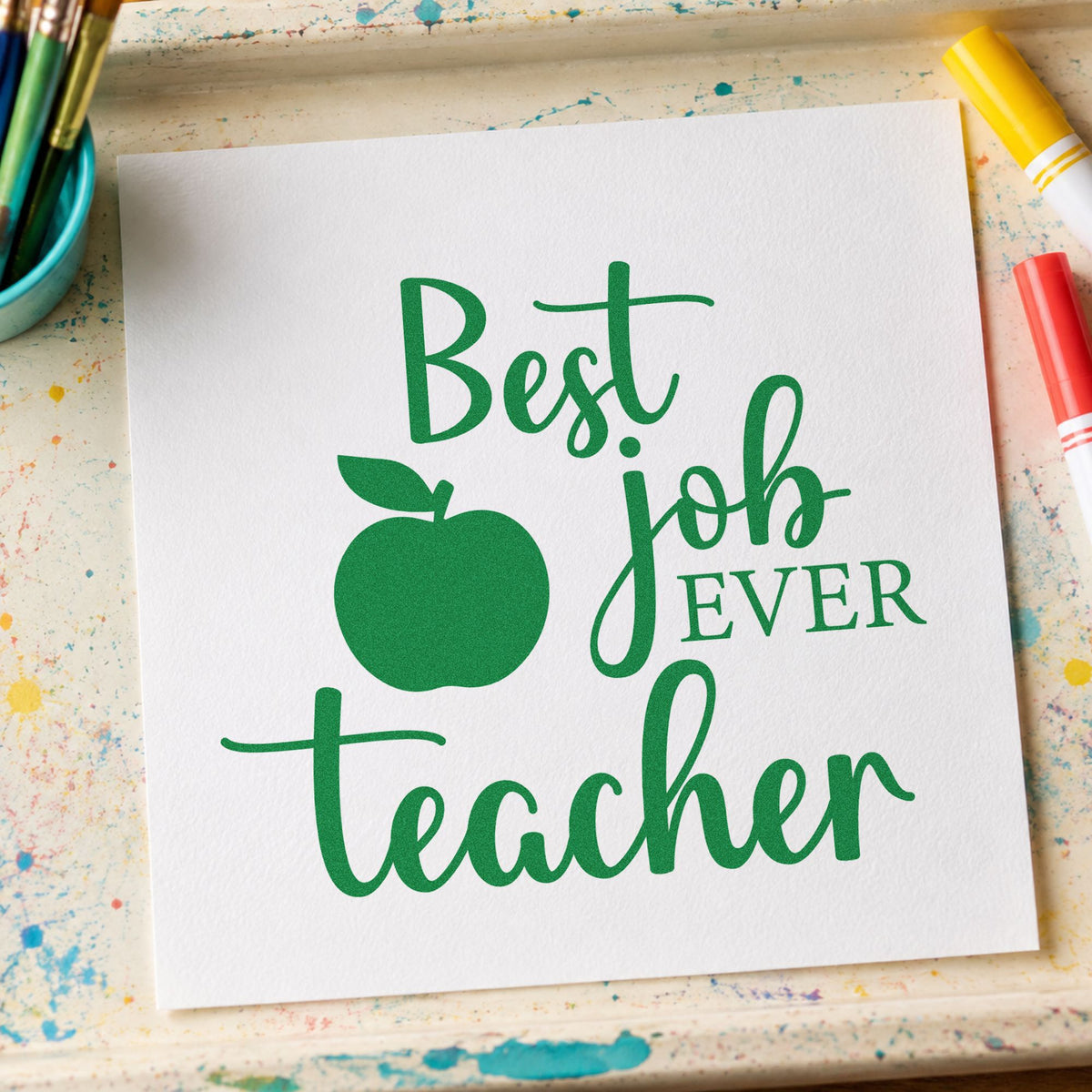 Best Job Ever Teacher craft stamp imprint in green ink on a handmade project, one idea being framed staff entry.