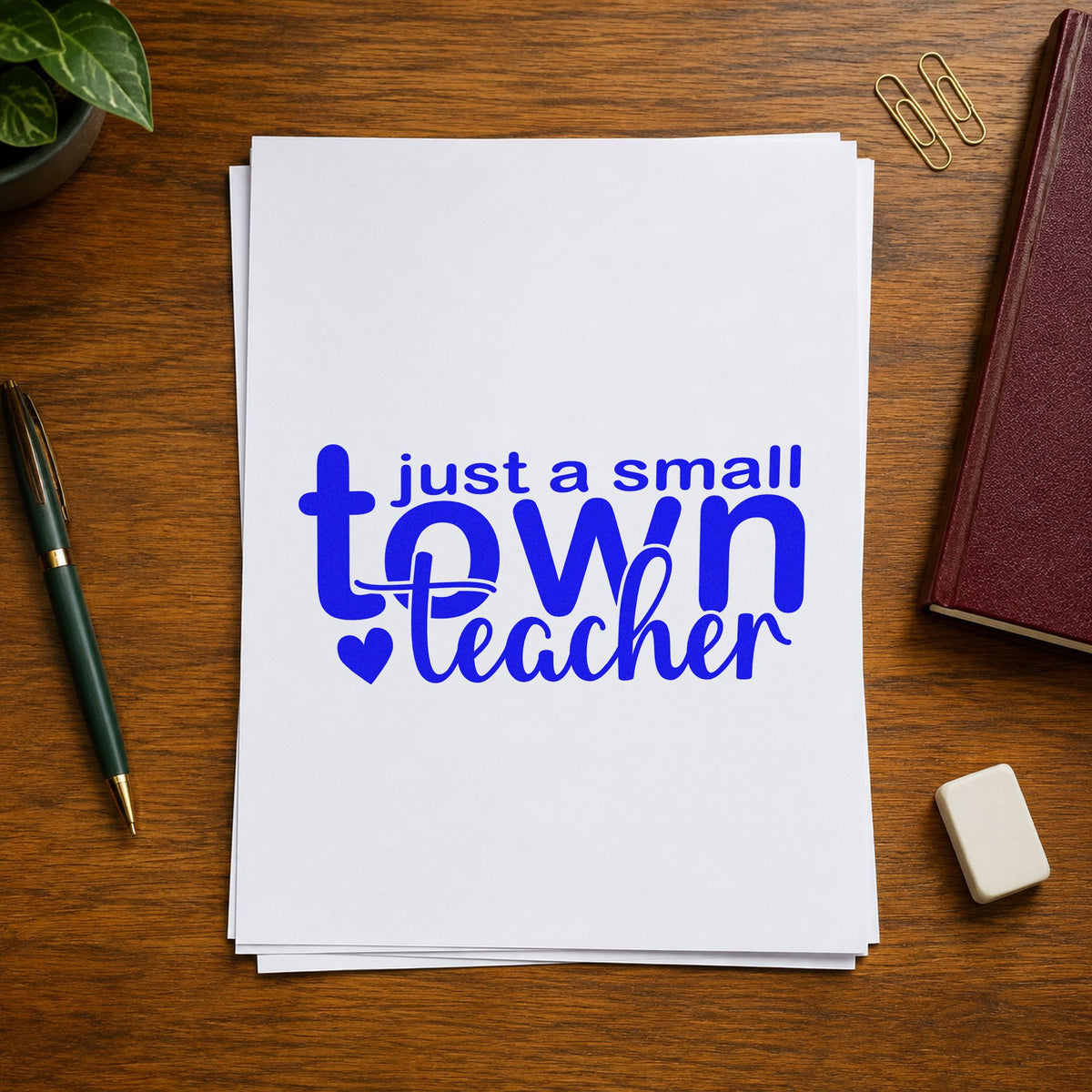 Small Town Teacher craft stamp imprinted in blue ink on paper, a design suited to raffle book seals.
