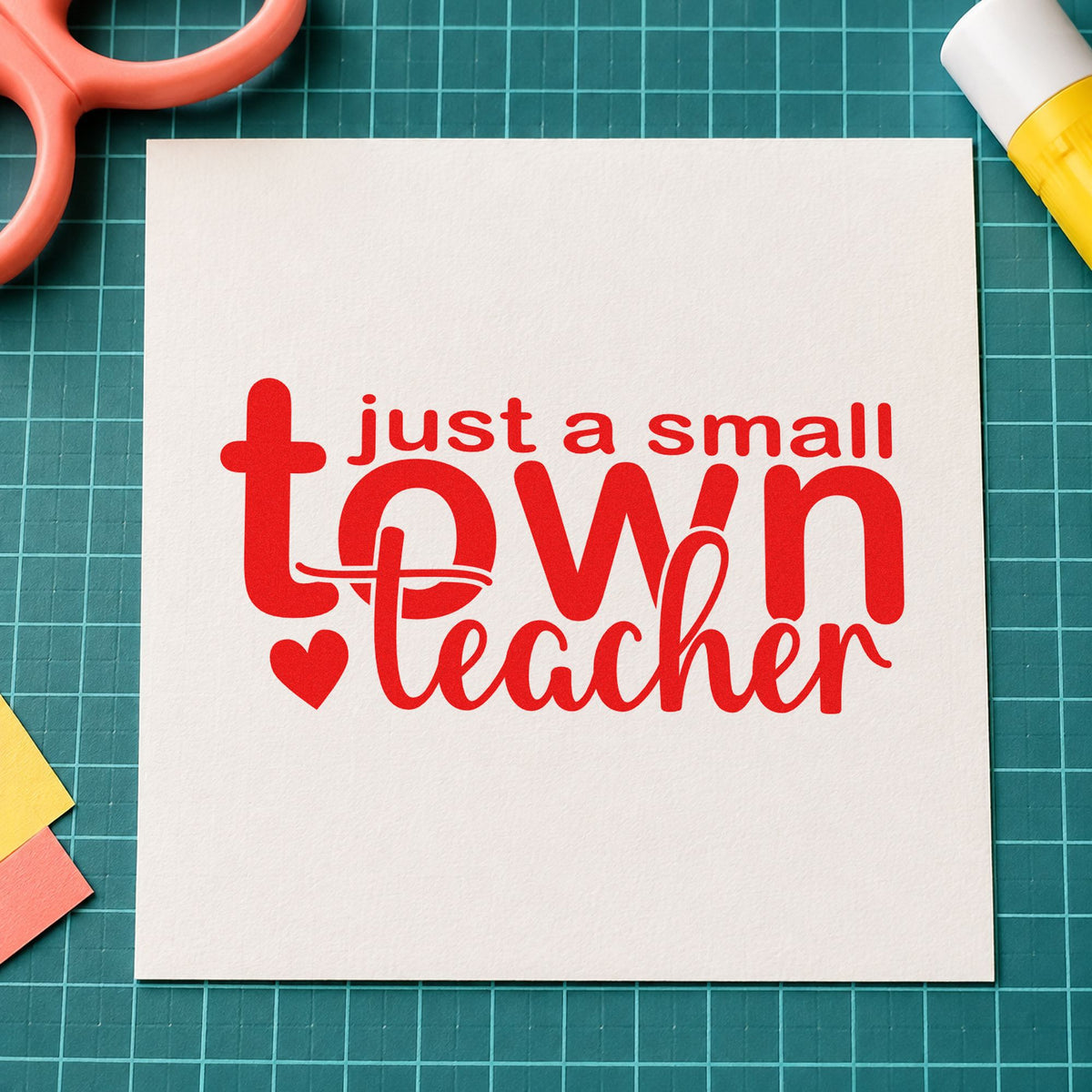 Small Town Teacher rubber stamp shown in red ink, stamped for projects such as harvest night notes.