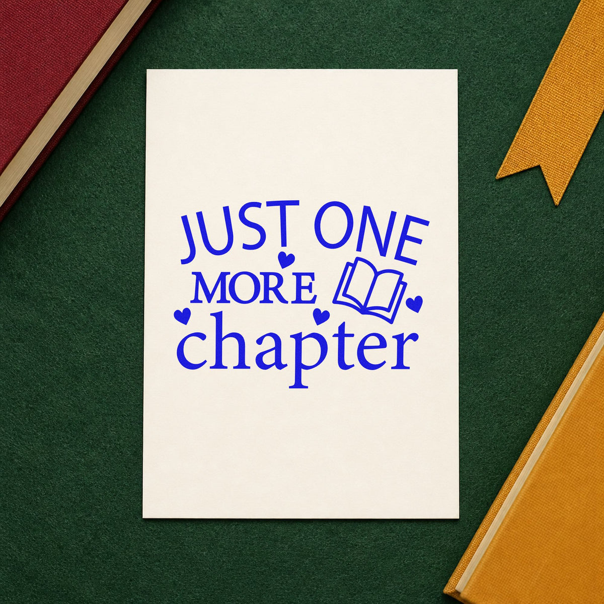 Just One More Chapter Book craft stamp imprinted in blue ink on paper, a design suited to reading bag seals.