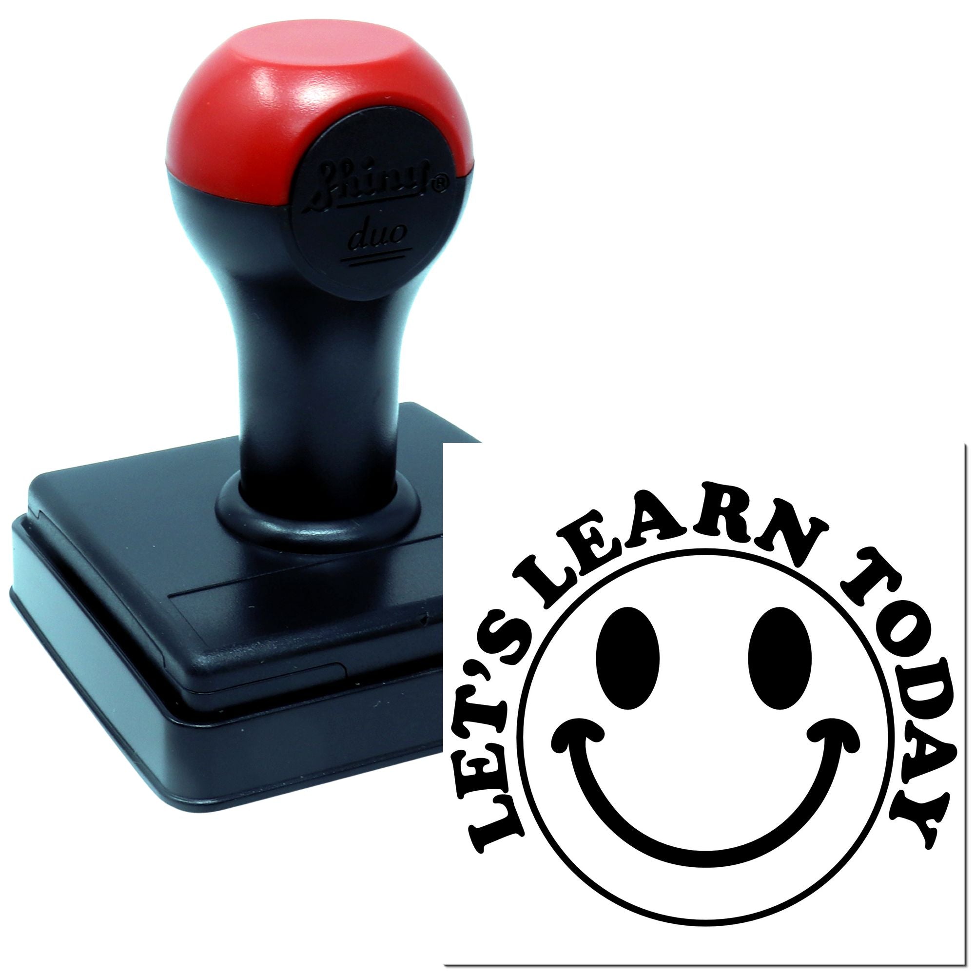 Self-inking rubber stamp with custom Learn Today smiley logo imprint for classroom and educational use.