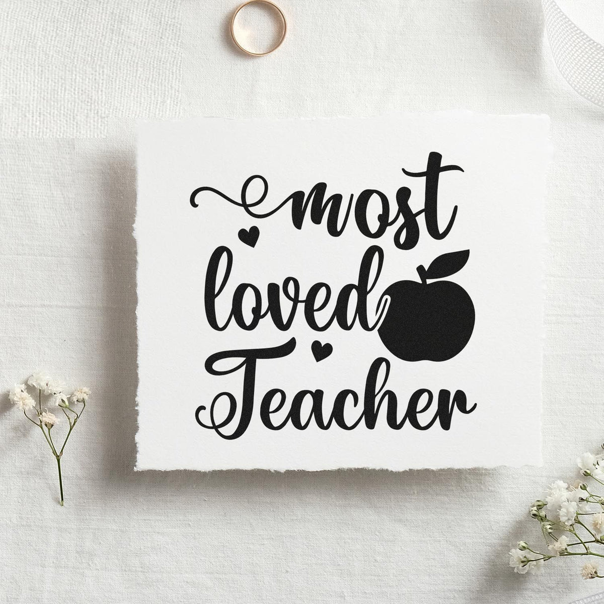 Most Loved Teacher Apple With Hearts Premium Wood-Mounted Stamp - Vintage Pro imprint stamped in black ink. "Most Loved Teacher" features a large apple and small hearts.