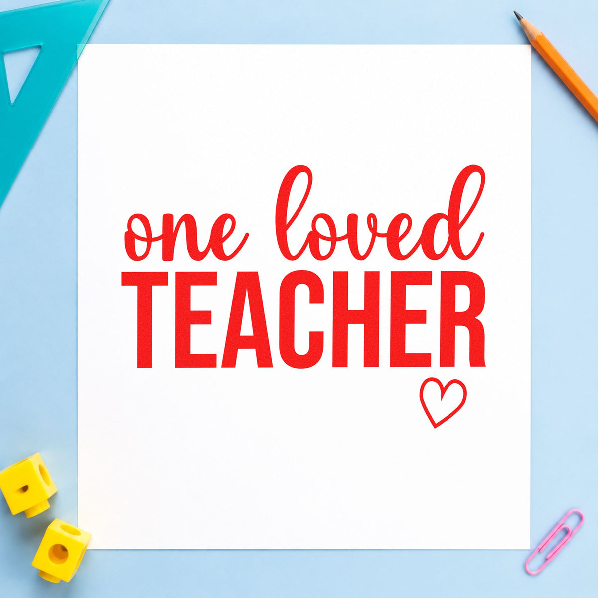 One Loved Teacher rubber stamp shown in red ink, stamped for projects such as honour night notes.