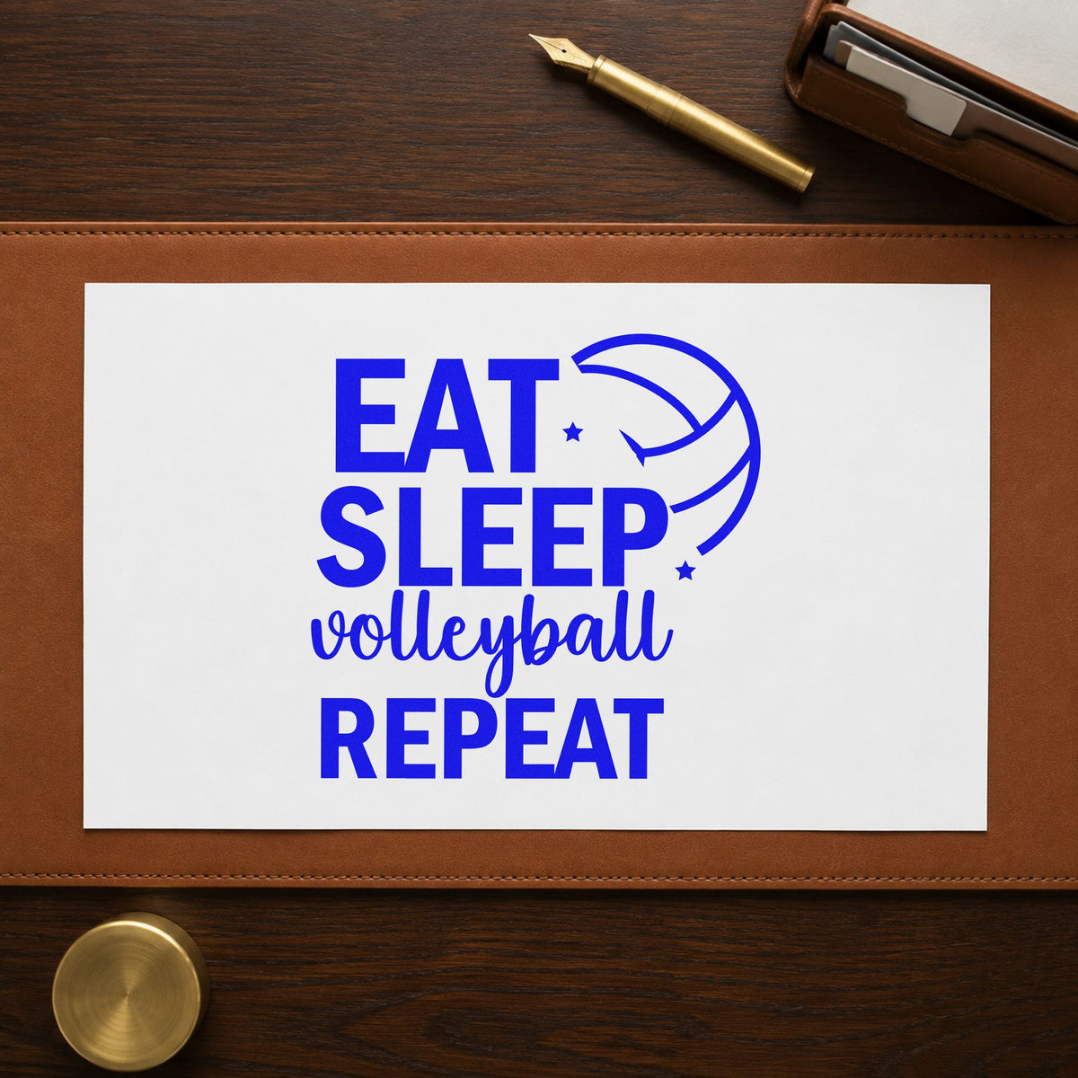 Eat Sleep Volleyball Repeat craft stamp imprinted in blue ink on paper, a design suited to tournament seals.