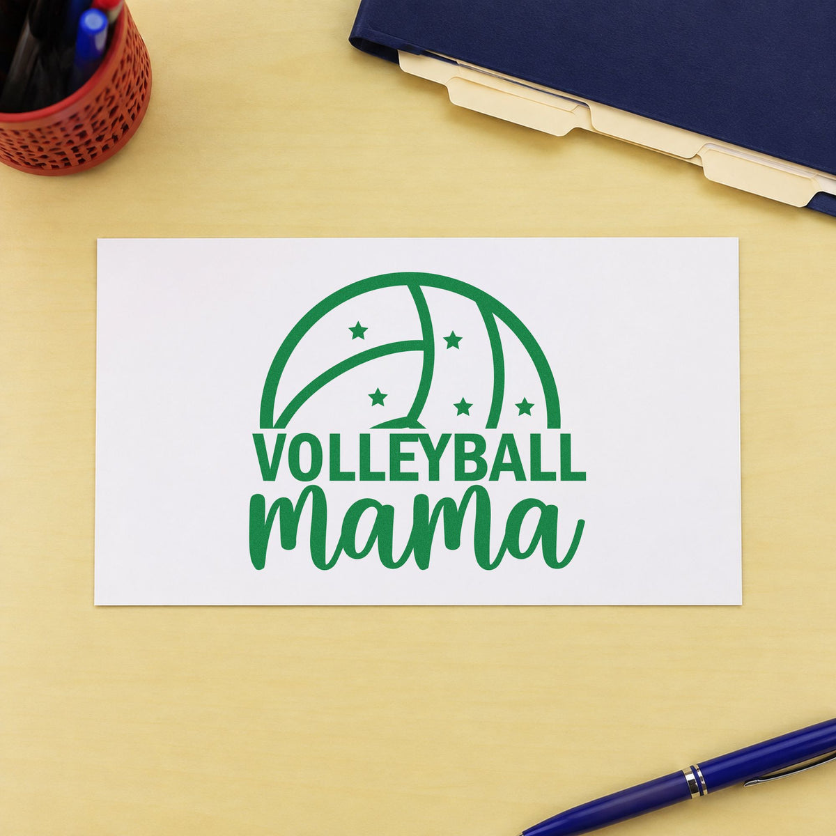 Volleyball Mama Ball craft stamp imprint in green ink on a handmade project, one idea being carpool rota pages.