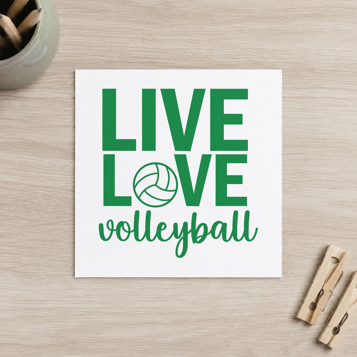Live Love Volleyball craft stamp imprint in green ink on a handmade project, one idea being framed bedroom net.
