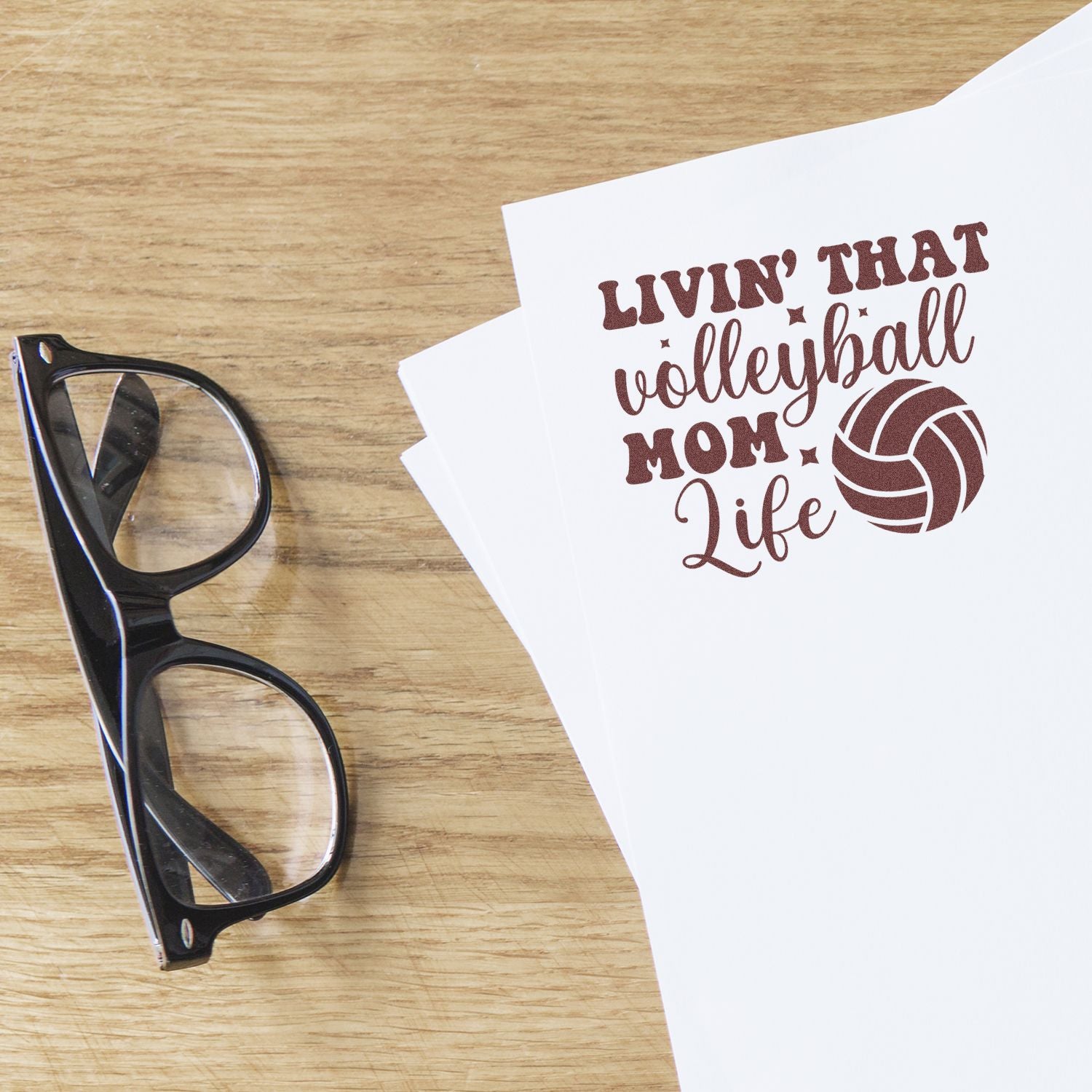 Volleyball Mom Life rubber stamp design on white paper, a custom sports craft stamp for cards, gifts and handmade projects.