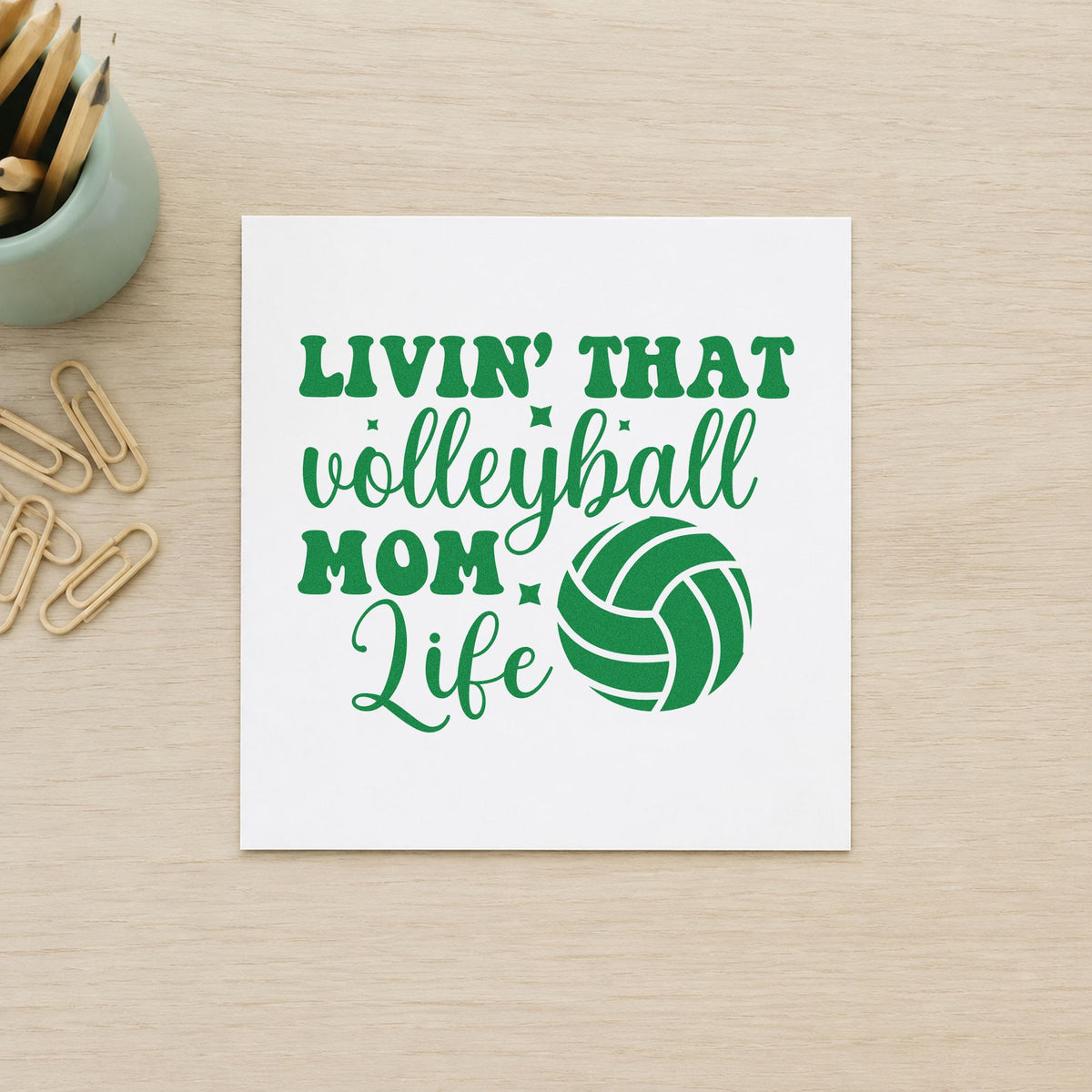 Livin That Volleyball Mom Life craft stamp imprint in green ink on a handmade project, one idea being framed car boot.
