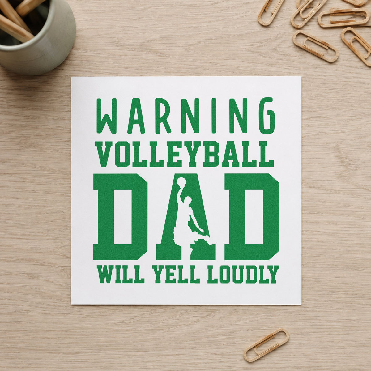 Warning Volleyball Dad Loud craft stamp imprint in green ink on a handmade project, one idea being holiday ornament crafts.