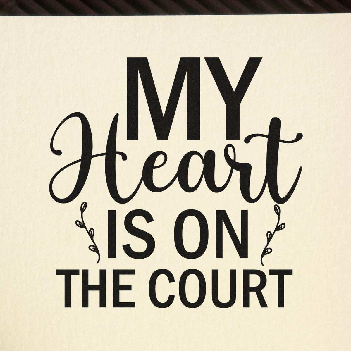 My Heart Is On The Court Premium Wooden Stamp - Vintage Pro imprint stamped in black ink. "My Heart Is on the Court" combines bold capitals and large script with leafy accents.