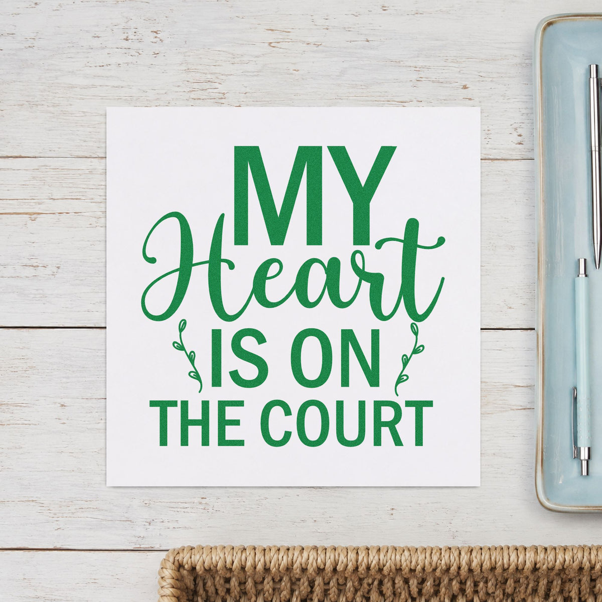 My Heart On The Court craft stamp imprint in green ink on a handmade project, one idea being memory book pages.