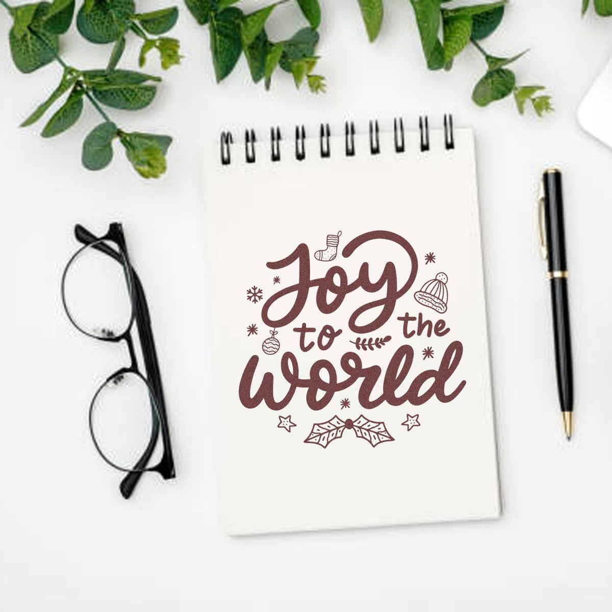 Joy To The World rubber stamp shown in brown ink, stamped for projects such as holiday gift wrap.
