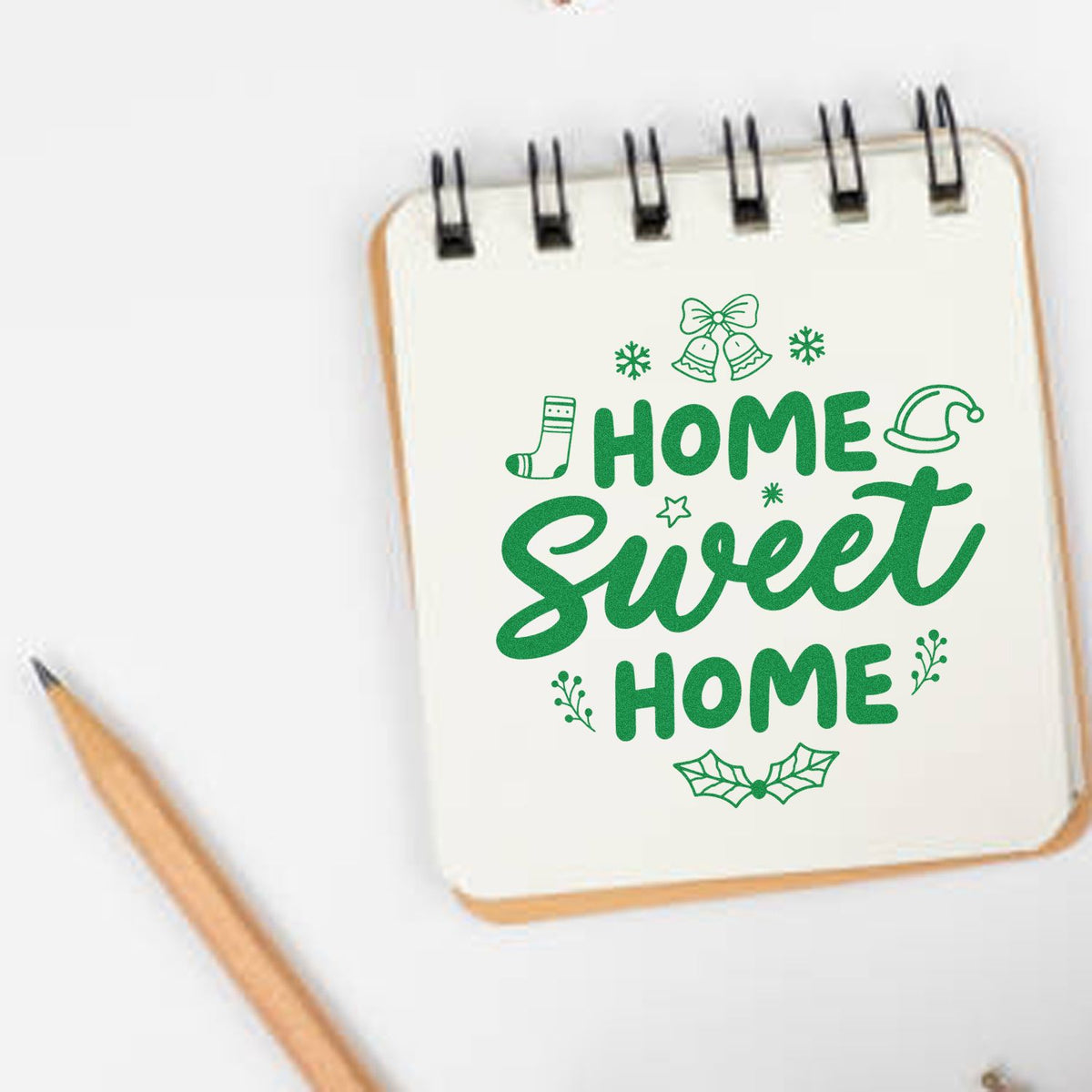 Home Sweet Home Christmas rubber stamp shown in green ink, stamped for projects such as housewarming tags.