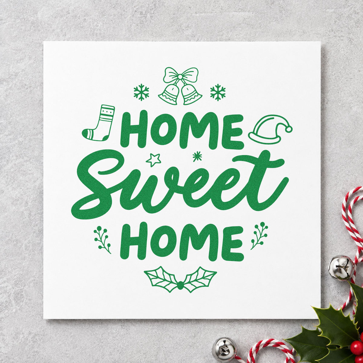 Home Sweet Home Christmas craft stamp imprint in green ink on a handmade project, one idea being guest room pages.