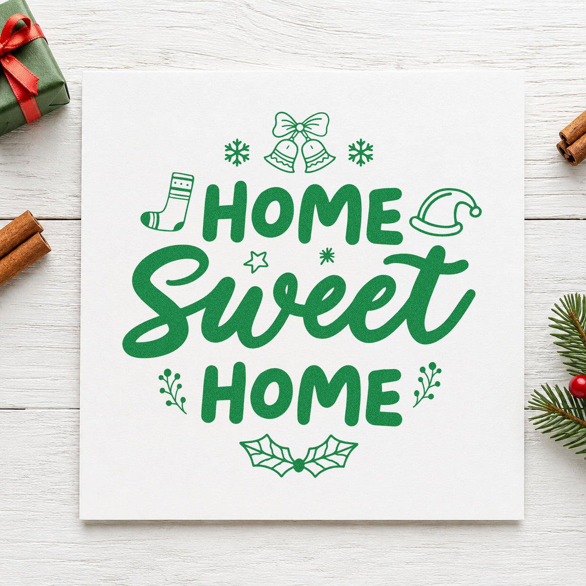 Home Sweet Home Christmas craft stamp imprinted in green ink on paper, a design suited to hamper lid seals.