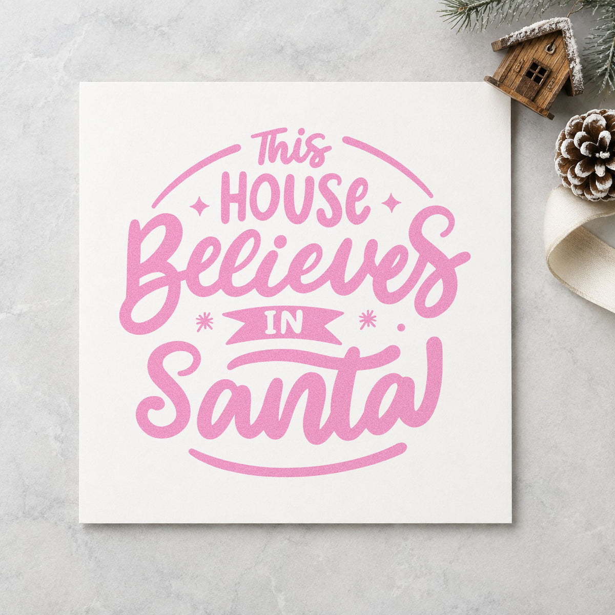 This House Believes In Santa craft stamp in purple ink on cardstock, an easy option for believer gift tags.