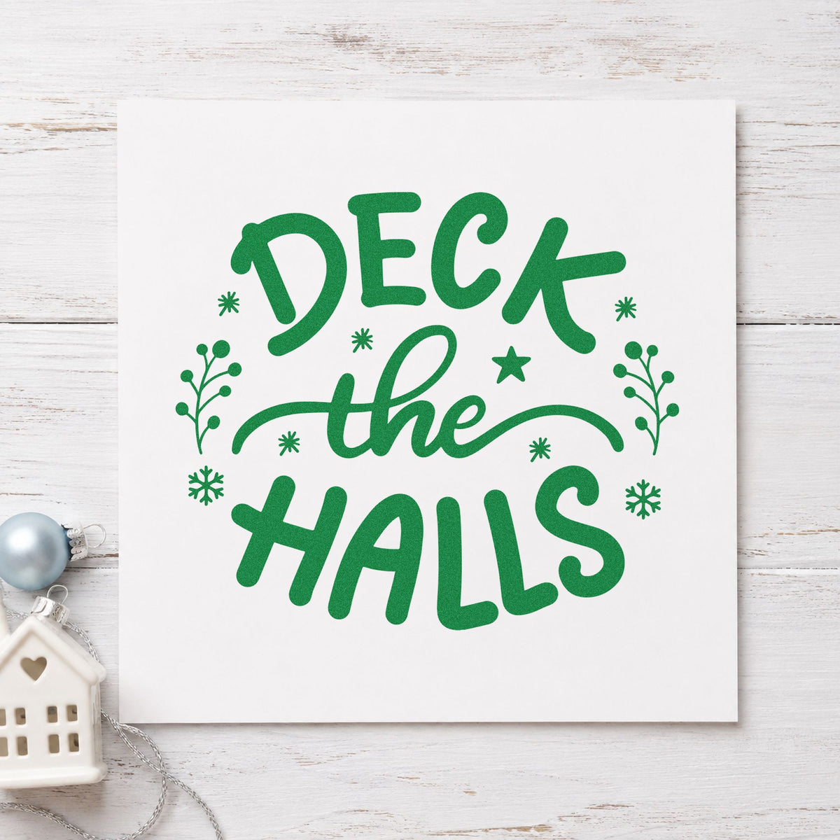 Deck The Halls Sprigs craft stamp imprinted in green ink on paper, a design suited to storage bag seals.