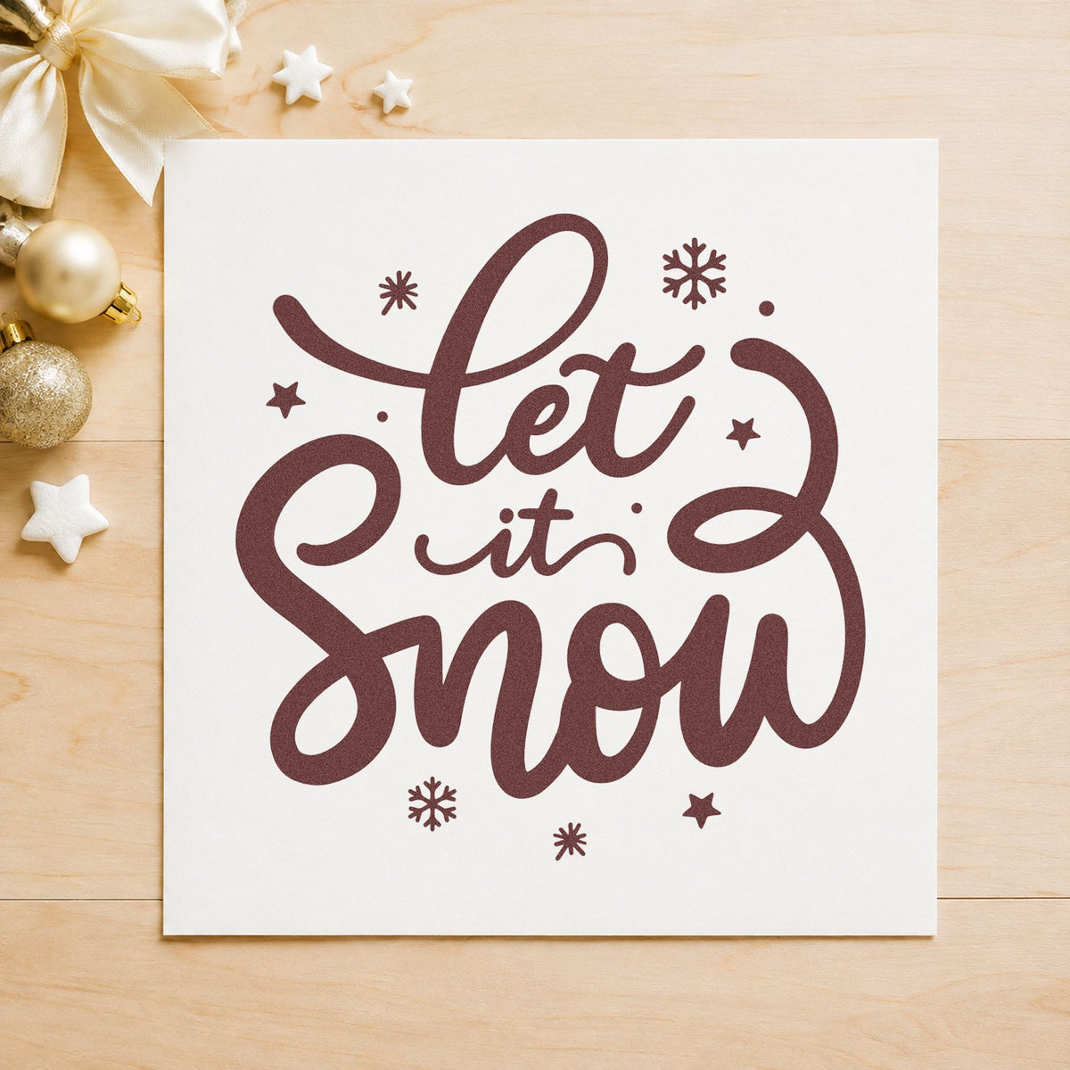 Let It Snow Script rubber stamp printed in brown ink, ready for hot drink labels and similar paper crafts.