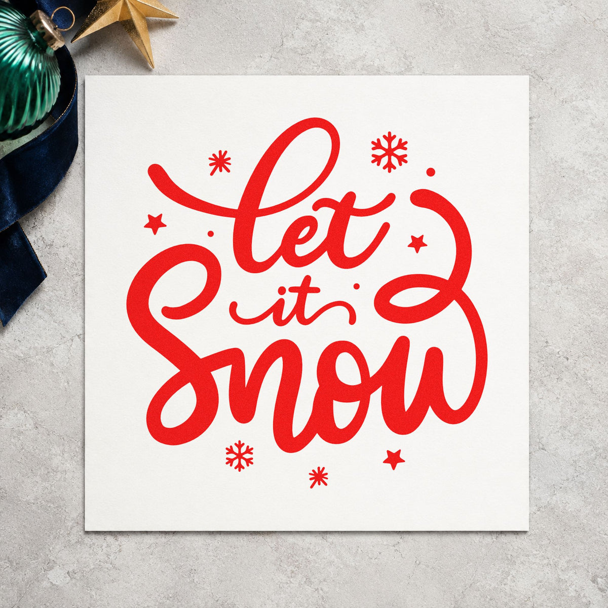 Let It Snow Script rubber stamp shown in red ink, stamped for projects such as first snow notes.